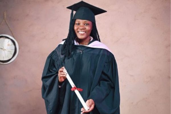Smiling girl holding degree certificate