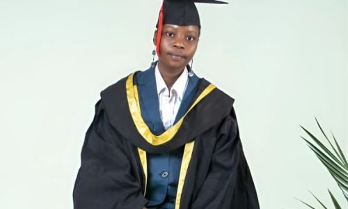 Loice. Girl Smiling wearing graduation cap and gown