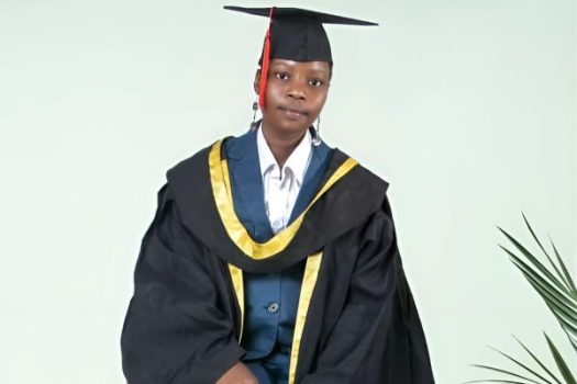 Loice. Girl Smiling wearing graduation cap and gown